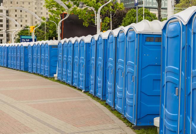 hygienic portable restrooms lined up at a beach party, ensuring guests have access to the necessary facilities while enjoying the sun and sand in Abington MA